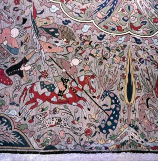Detail of a Persian style carpet showing hunters on horseback