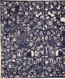 A batik kain (long cloth usually worn as a wrapper) with a design of elephants, lions, deer and other wild animals