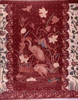 A detail of the design on a batik sarong which incorporates herons and other birds, flowers and water plants