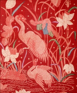 A detail of the design on a batik sarong which incorporates herons and other birds, flowers and water plants