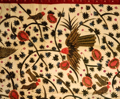 A detail of the design on a batik sarong which incorporates birds, flowers and water plants