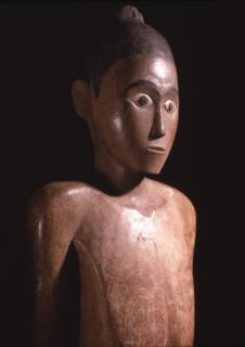 Regarded as a portrait of the deceased, a tau tau figure was dressed in his or her clothes and stood guard over the body on a balcony of the tomb cut into the cliff face
