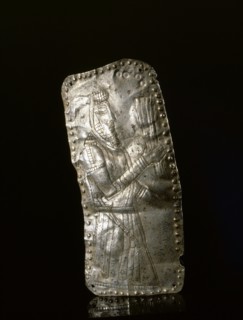 Silver repousse plaque depicting a male figure