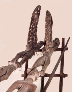 Phallic figures surmounting Asmat pole sculptures known as bis poles