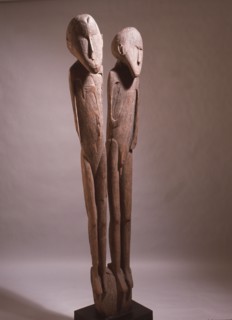 A carving depicting paired male and female clan ancestors, from a Lake Sentani mens meeting house