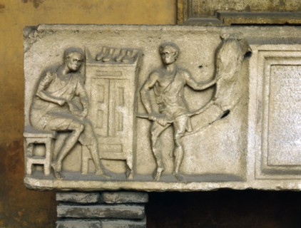 Part of a sarcophagus with a relief showing a shoemaker at work