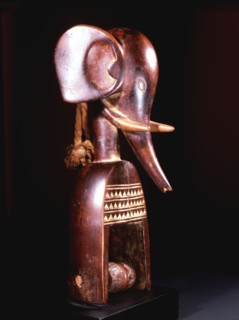 Heddle pulley used to support the cord to the foot pedals which alternate the heddles on the narrow strip loom typical of West African mens weaving