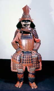 This suit of armour bears a Buddhist gold lacquer inscription on the breastplate