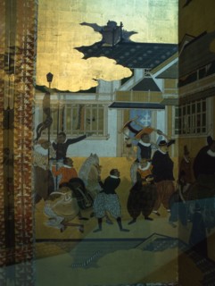 Detail from a folding namban jin or southern barbarian screen depicting a harbour scene recording the arrival of exotic looking Portuguese merchants in Japan