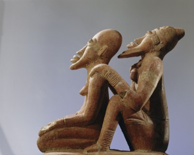 Terracotta figures of a man seated behind a woman