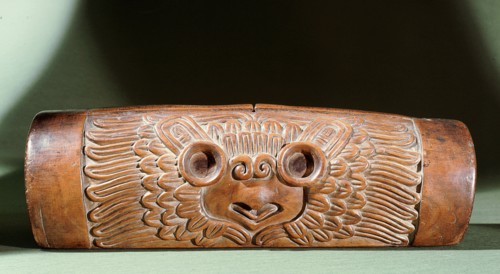 A teponaztli or two toned drum with a horned owl carved on the side