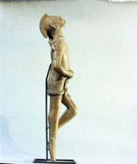 Figurine of a man singing and dancing at a festival