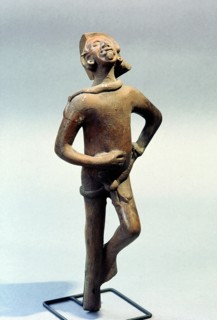 Figurine of a man singing and dancing at a festival