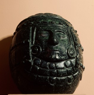Green stone carving of a deity