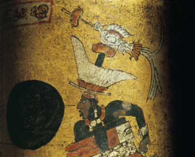 Cylindrical vessel decorated a Mayan ball player wearing black body paint and heavy padding for the competition