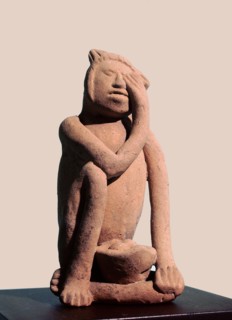 Figurine of a woman crying