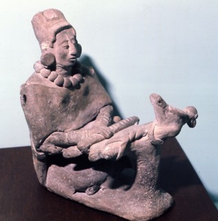 Figurine of a woman weaving