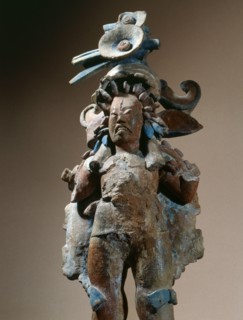 Figure of a warrior with facial tattooing