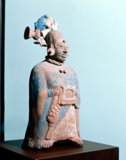 Figurine of a woman of rank, with a fine cotton huipil, elaborate hairstyle and facial decoration consisting of scarring on the chin and between the eyebrows
