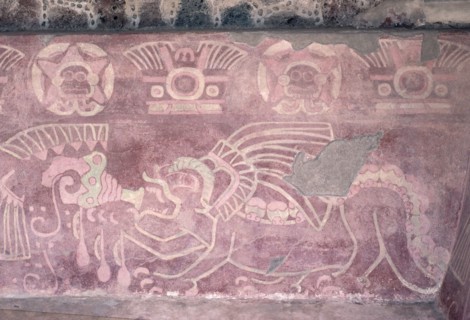 Detail of a polychrome Jaguar mural showing the animal blowing a conch shell