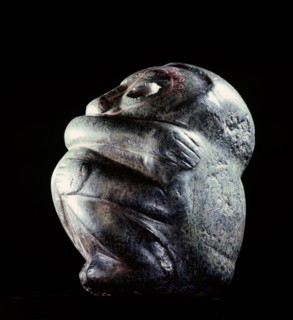 Figure in the form of a seated man