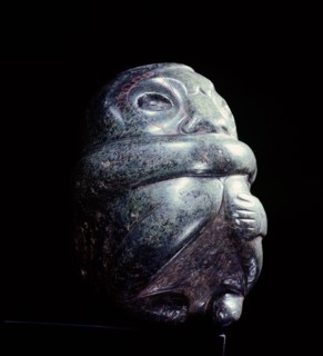 Figure in the form of a seated man