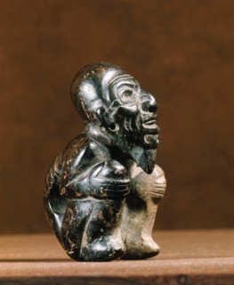 Olmec figure of a crouching man