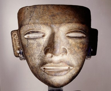Stone funerary mask, placed on the face of an important corpse as part of the burial attire