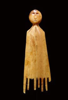 Comb in the shape of a stylized figure