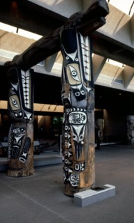 Two front house posts in the form of sea lions support the main beam of the house in the form of Sisiutl, the double headed serpent