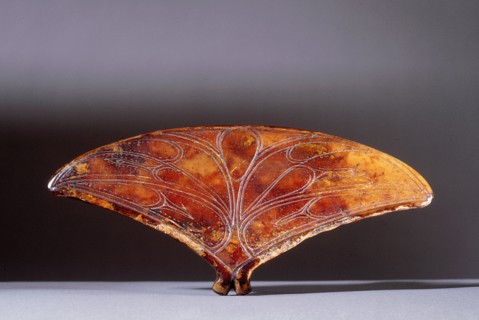 Fan shaped ivory object with incised decoration