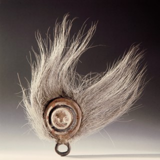 A finger mask used by women during dance entertainments