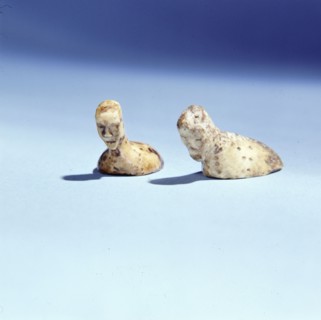 Flat bottomed figurines with human heads