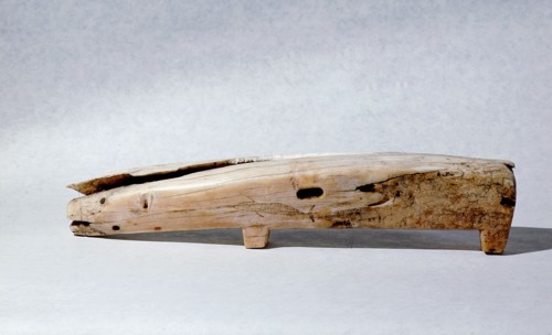 Bone handled knife in the shape of a polar bear, with an incised whale