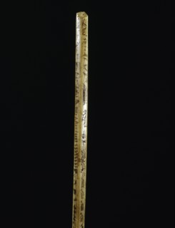 Broken ivory bow drill handle with incised sketches of hunting and travel scenes