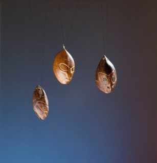 Nuts or seeds carved with ancestral faces