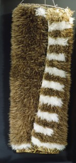 A kiwi feather cloak with a taniko tapestry border