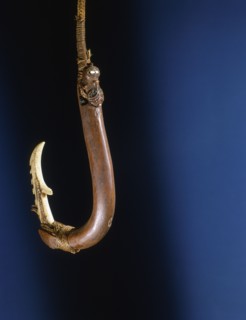A barbed composite matau fish hook, the shank made by training a growing branch into shape
