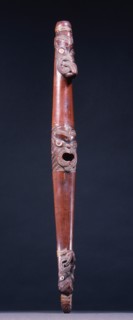 Putorino, or flute trumpet carved with three aggressive faces