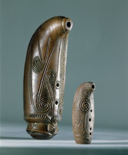 Nguru, open tube flutes, with three finger holes are blown across the wide end