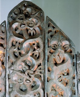 Five carved wooden end panels from a storehouse
