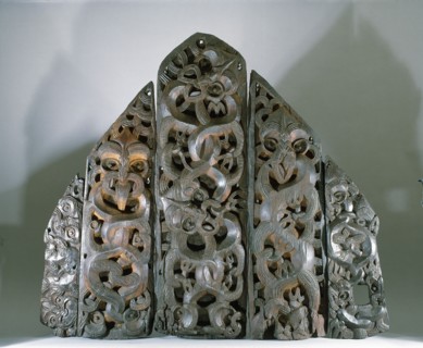 Five carved wooden end panels from a storehouse