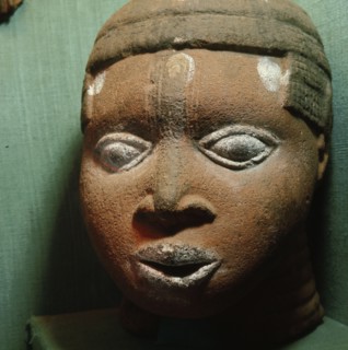 A terracotta head from the ancestral shrine of a leading member of the brass casting guild