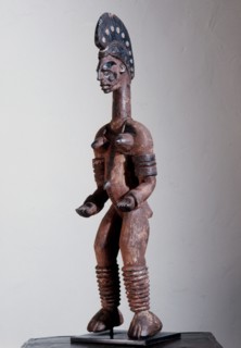 Female shrine figure, part of a family of such figures kept in a village shrine, illustrating the continuity of social roles in the world of the living and that of the spirits