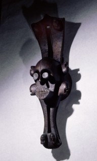 Mask representing a water spirit, worn horizontally on top of head, surrounded by fibre costume Used in plays depicting the exploits and social life of the water spirits, which mirrors that of the vil...