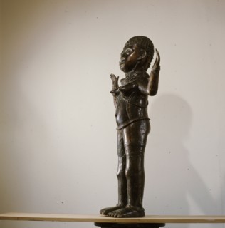 Along with two similar figures in museum collections this sculpture is a puzzling hybrid