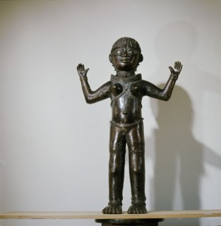 Along with two similar figures in museum collections this sculpture is a puzzling hybrid
