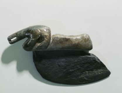 The Norton Eskimos introduced many of the tools that came to be so characteristic of historical Eskimos, including this slate womans knife or ulu which was used with a rocking rather than thrusting mo...