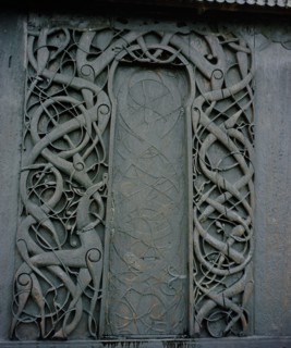Carving on the side of the stave church at Urnes