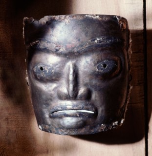 Copper mask of a human face